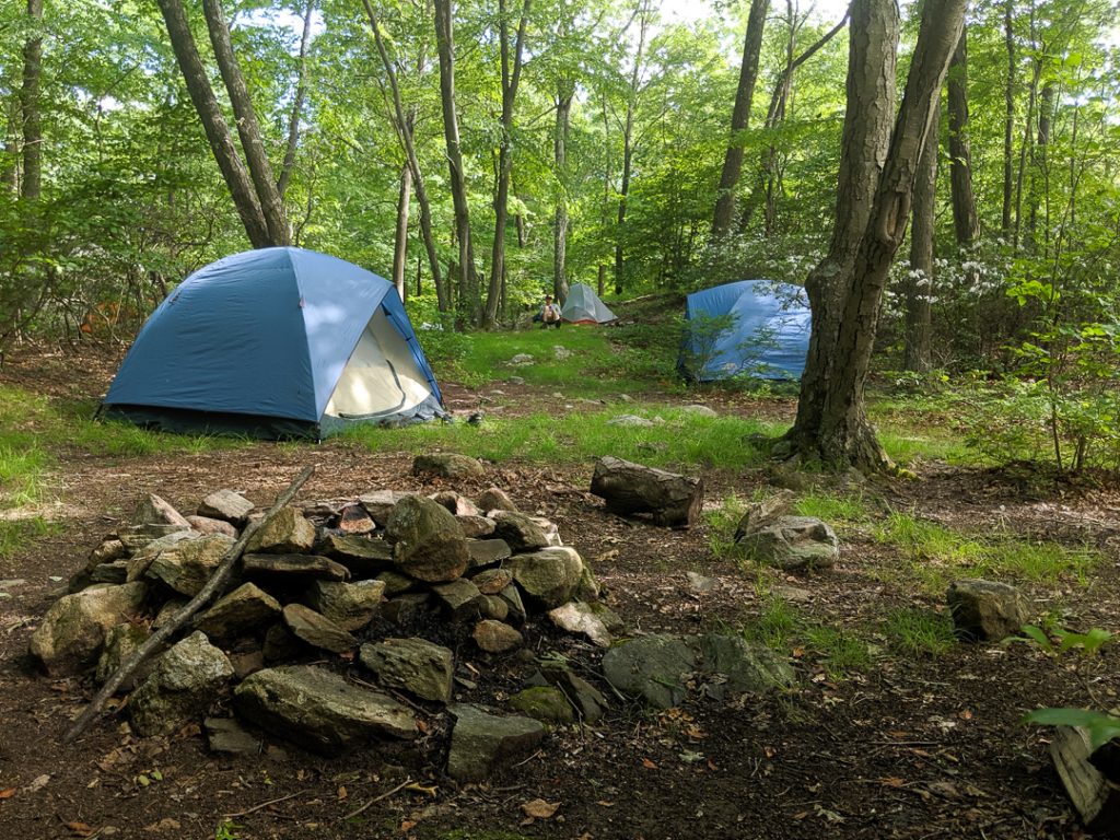 View of campsite, firepit, tents